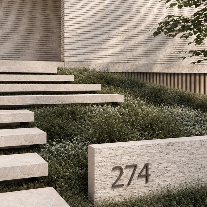 Close-up render of floating stone steps over planting beside a rendered wall.